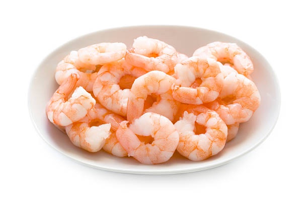 fresh cooked king prawns in a dish isolated on a white background